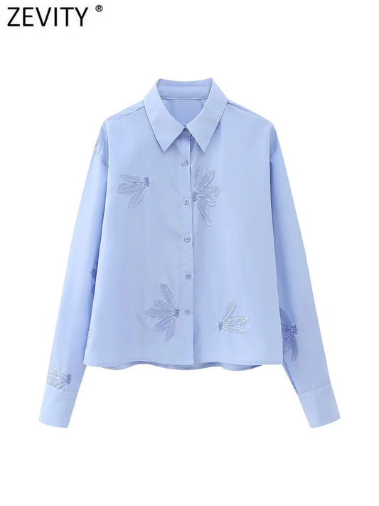 Blusa feminina fashion com bordado de flores em paetê, modelo curto estilo smock, manga longa, camisa cropped elegante para escritório